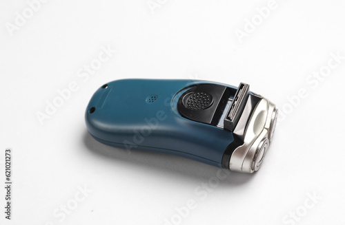 Electric razor on a gray background