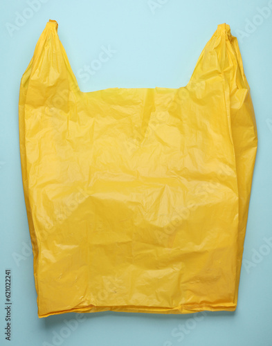 Yellow cellophane bag on a blue background
