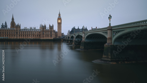 The Westminster Bridge and the Big Ben clocktower by the Thames river in London at dawn, United Kingdom