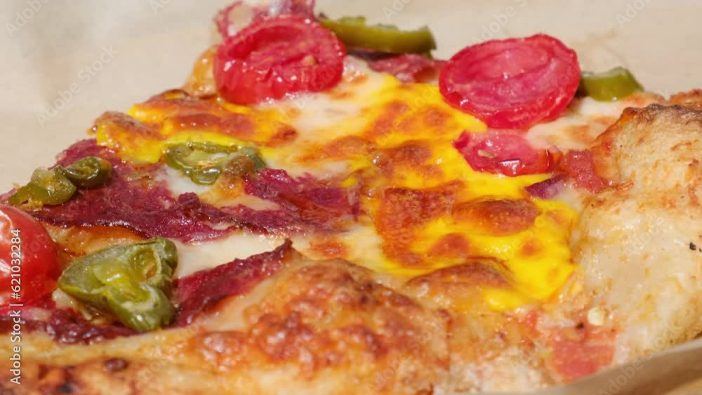 Italian pizza with mozzarella and sausage on a rotating platform Italian pizza with mozzarella and sausage on a rotating platform