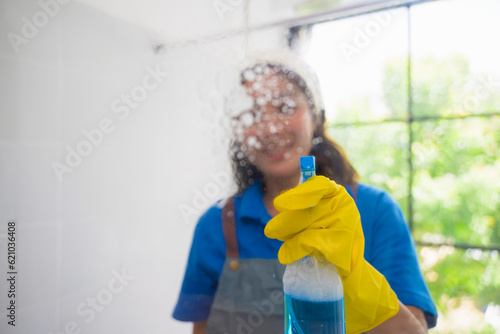 Happy woman cleaning house, Housekeeping and cleaning service, People doing housework at home photo