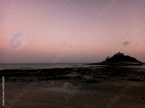 A full moon over St Michaels Mount near Marazion in Cornwall, UK