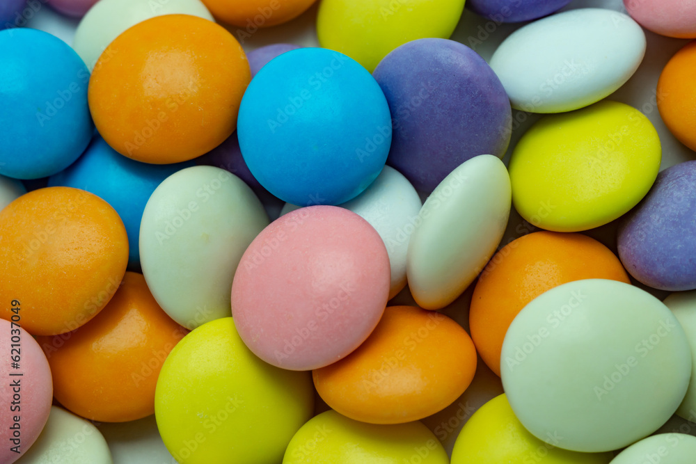 Candy Explosion: Colorful Dragees Fill the Background in a Sweet Delight Candy Explosion: Colorful Dragees Fill the Background in a Sweet Delight