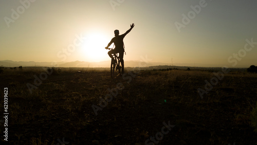 Riding High  Thrilling Adventures of Mountain Bikers Beneath the Sunlit Peaks