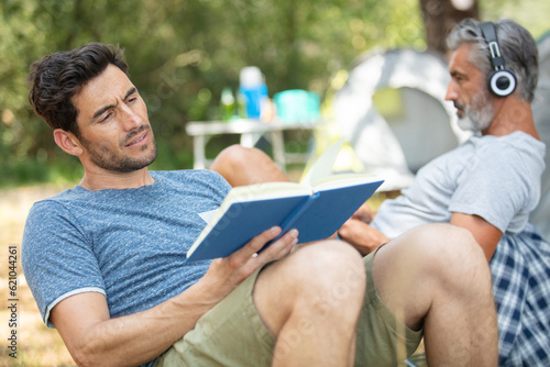 male friends relaxing at camping site