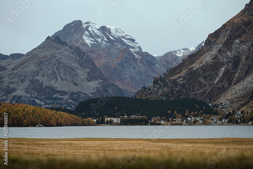 Panoramic view of the swiss mountain range near the Sils Lake, in the Maloja region, during a cloudy autumnal day photo