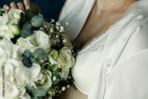 
wedding bouquet of hydrangeas in the hands of the bride close-up