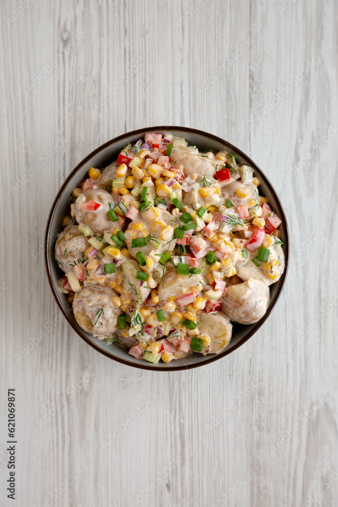 Homemade Summer Potato Salad in a Bowl, top view. Flat lay, overhead, from above. Homemade Summer Potato Salad in a Bowl, top view. Flat lay, overhead, from above.
