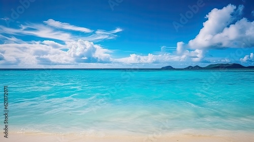 On a hot summer day, there is a beautiful beach with white sand. The sky is overcast blue, and the water is turquoise. Summer vacation background with a natural backdrop, soft focus, and text space