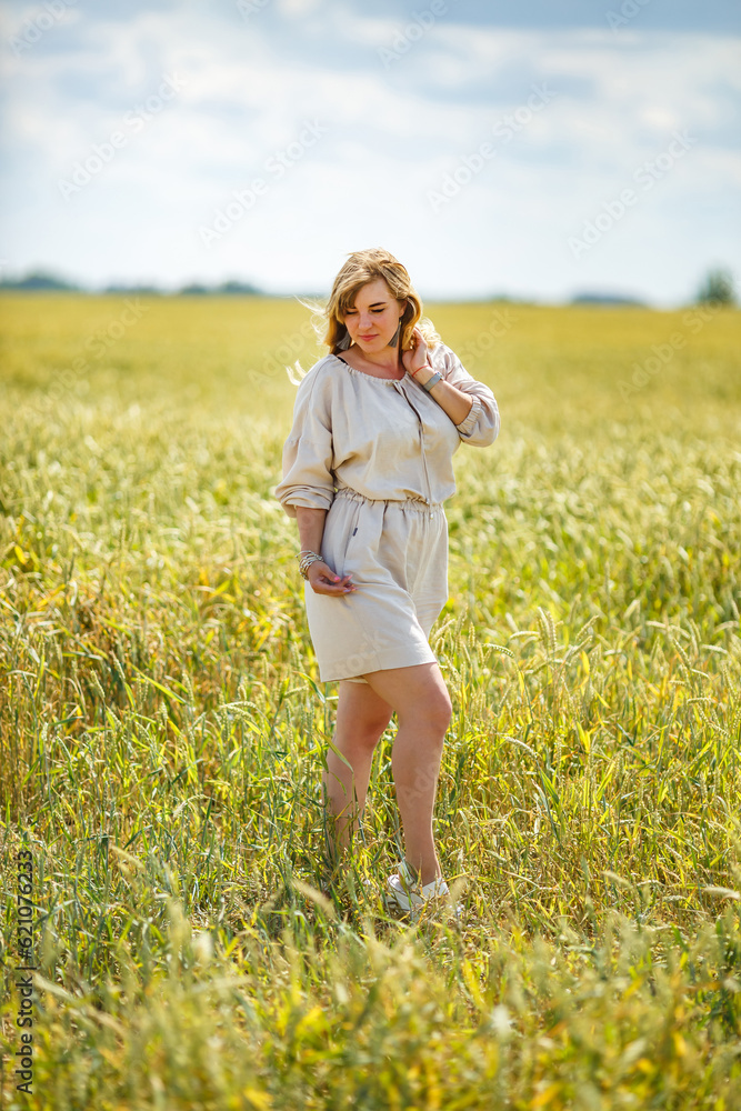 beautiful girl in a linen dress in a wheat field beautiful girl in a linen dress in a wheat field