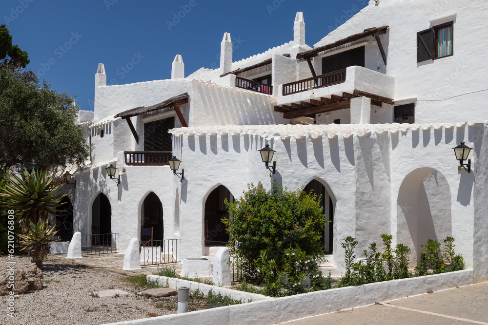 White houses in the picturesque coastal village of Binibequer on the Spanish island of Minorca.