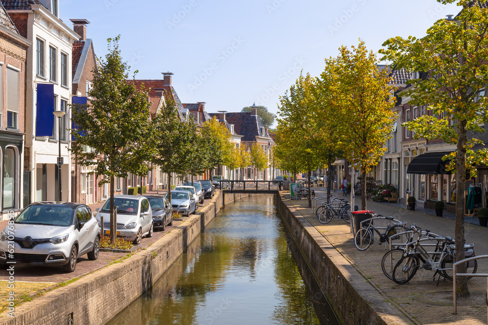 Canal with houses and shops in the center of the city of Franeker in Friesland.
