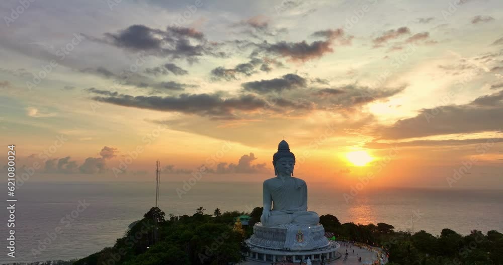 aerial view around Phuket big Buddha in beautiful sunset..360 degree view on Phuket big Buddha viewpoint..Video clips for travel and religious ideas..smooth cloud in stunning sky background. aerial view around Phuket big Buddha in beautiful sunset..360 degree view on Phuket big Buddha viewpoint..Video clips for travel and religious ideas..smooth cloud in stunning sky background.