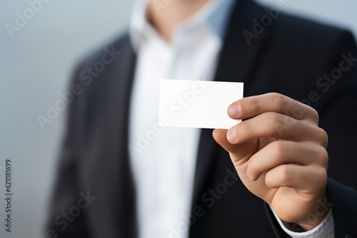 A person holding a business card in their hand © MUS_GRAPHIC