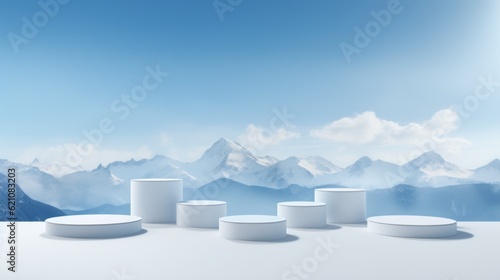 White podiums for product display on the background mountains with snow sky are blue. © Анастасия Комарова