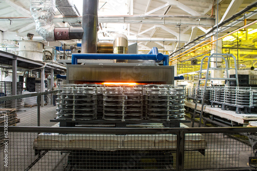 Likino-Dulevo, Moscow region, Russia - July, 7, 2023: workplace in the workshop at a porcelain factory with ceramic blanks of dishes and an automatic machine
