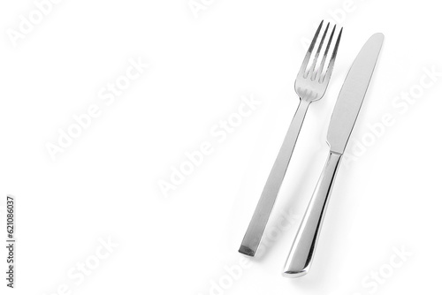 Knife and fork isolated on white background. Elegant shiny cutlery set
