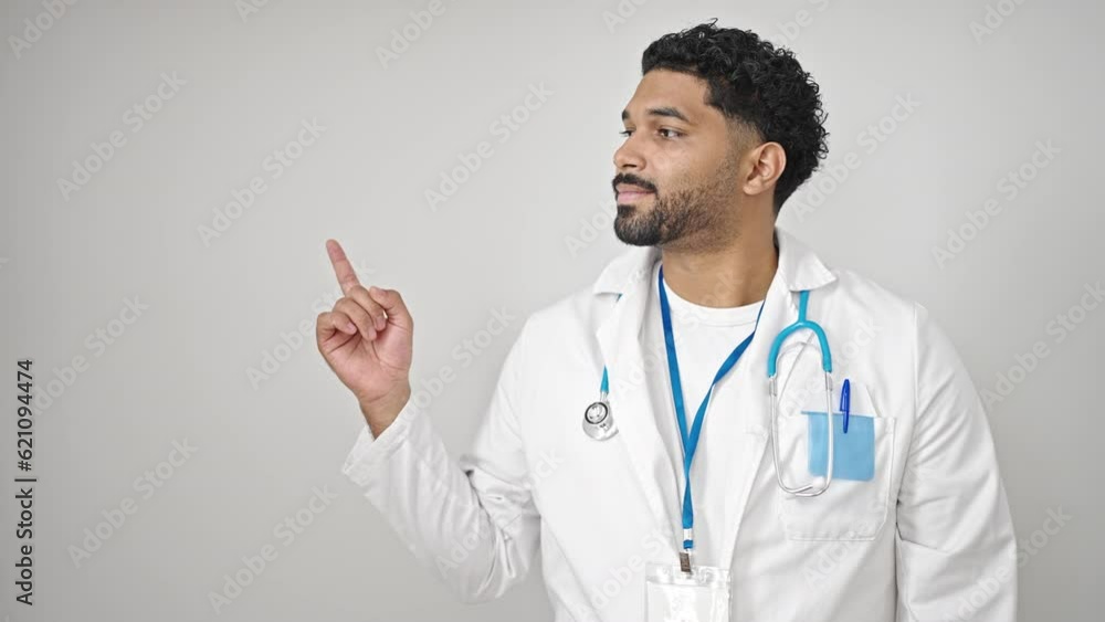 African american man doctor smiling pointing to the side over isolated white background African american man doctor smiling pointing to the side over isolated white background