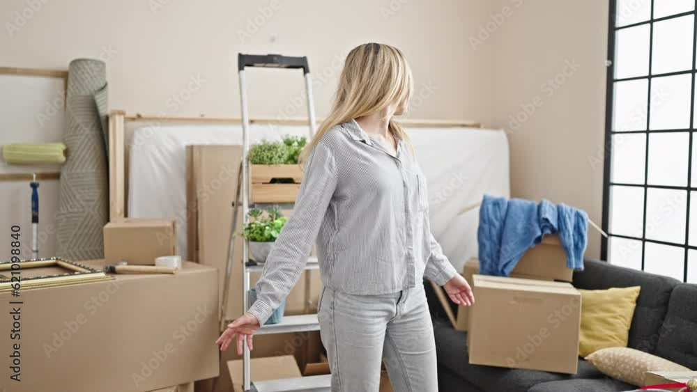 Young blonde woman smiling confident standing at new home Young blonde woman smiling confident standing at new home