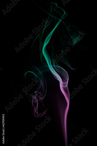 Coloured smoke. Black background. Colourful smoke images. Abstract photographs of smoke.