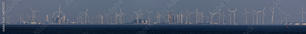 a modern offshore wind park and industrial panorama at sea