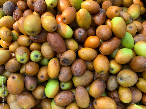 Fototapeta Naklejka Na Ścianę i Meble -  Top view of red-brown Bair Fruit of Asia. Pattern background of Jujube Fruit Bair Fruit or China Apple in Punjab, Punjab, Pakistan.