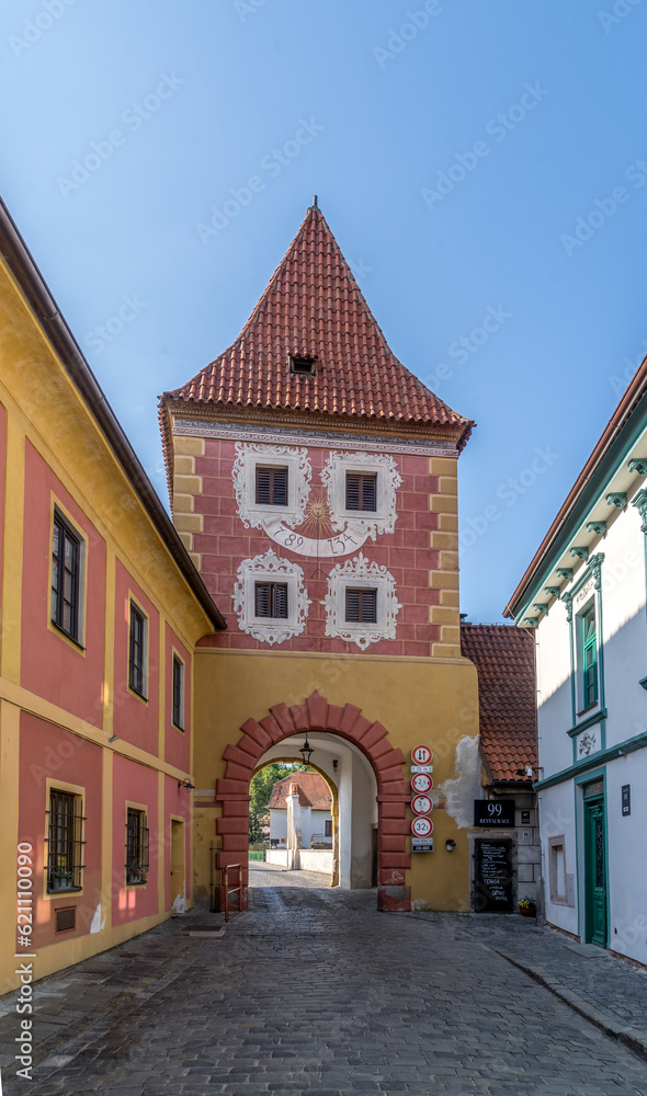 Cesky Krumlov colorful medieval rectangular town gate with red roof