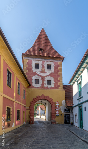 Cesky Krumlov colorful medieval rectangular town gate with red roof