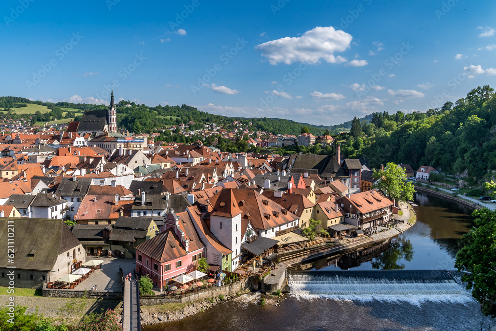 Aerial view of Cesky Krumlov with waterfall on the Vltava river