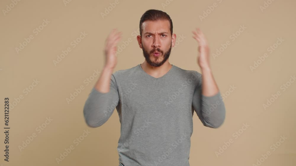 Oh my God, Wow. Excited amazed winner man surprise looking at camera with big eyes, shocked by sudden victory. Sincere confused shocked handsome lebanese guy isolated alone on beige studio background Oh my God, Wow. Excited amazed winner man surprise looking at camera with big eyes, shocked by sudden victory. Sincere confused shocked handsome lebanese guy isolated alone on beige studio background