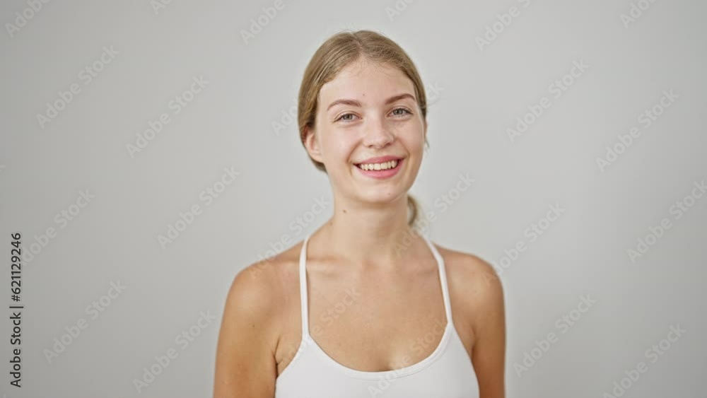 Young blonde woman smiling confident standing over isolated white background Young blonde woman smiling confident standing over isolated white background