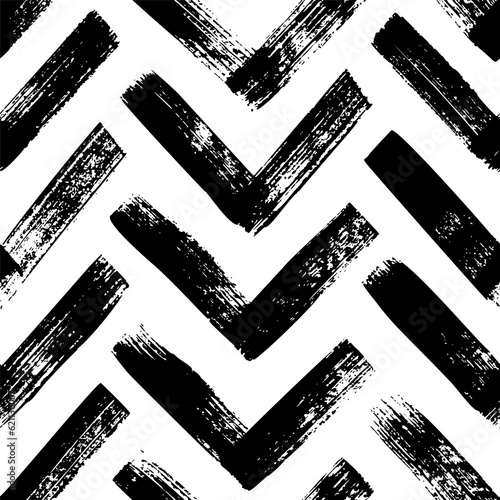 Brush drawn bold herrigbones seamless pattern. Vector zigzag motif. Geometric chevron abstract background with rough bold stripes. Modern geometric background in sketchy style. Grunge chevron pattern.