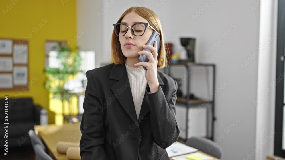 Young blonde woman business worker talking on smartphone working at office Young blonde woman business worker talking on smartphone working at office
