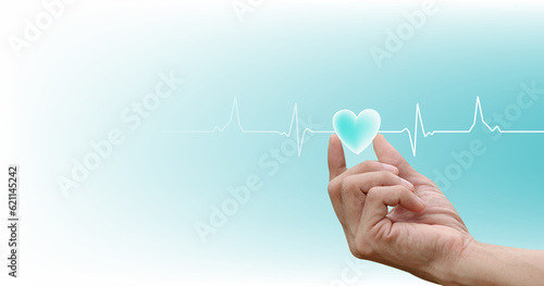 Healthcare concept. heart-shaped on hand with the heartbeat line pulse rhythm icon on blue, white background.