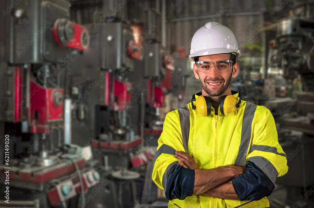 The engineer man smiles and cross his hands while inspect the factory The engineer man smiles and cross his hands while inspect the factory