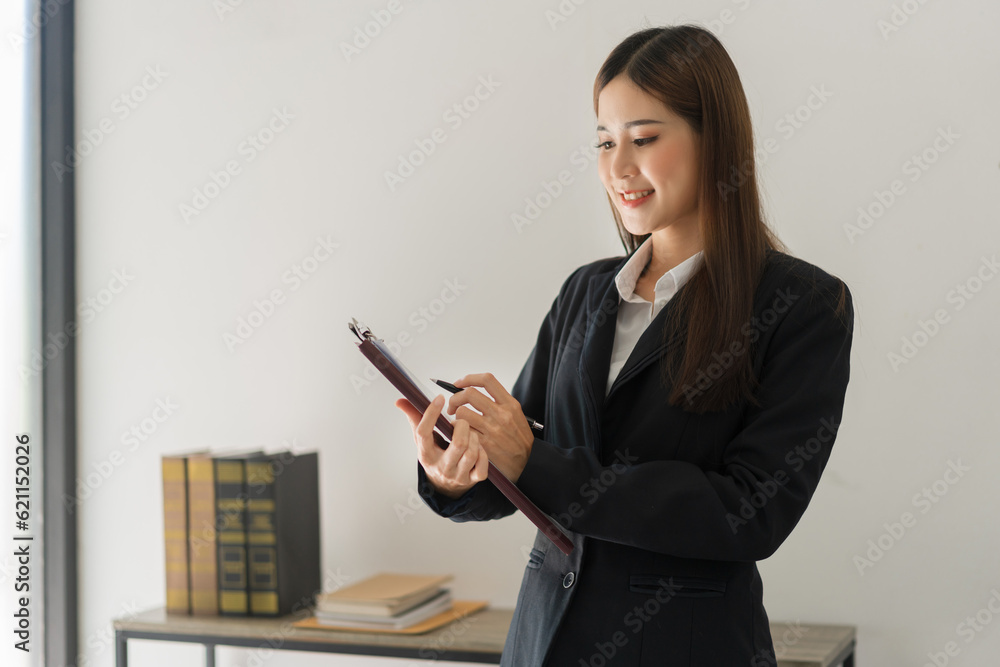 Legal and justice concept, Female lawyer reading contract about regulation and working in law firm Legal and justice concept, Female lawyer reading contract about regulation and working in law firm