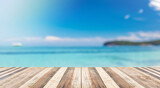 Blurred sea background with wood resort deck floor foreground