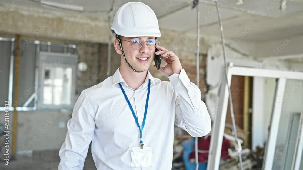 Young hispanic man architect smiling confident talking on smartphone at construction site Young hispanic man architect smiling confident talking on smartphone at construction site