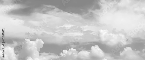 Grey sky with white clouds in rainy season, beautiful grey and white sky background textures, black and white sky, cloudy sky with stormy clouds. Low cumulus clouds of various shapes cover almost the	