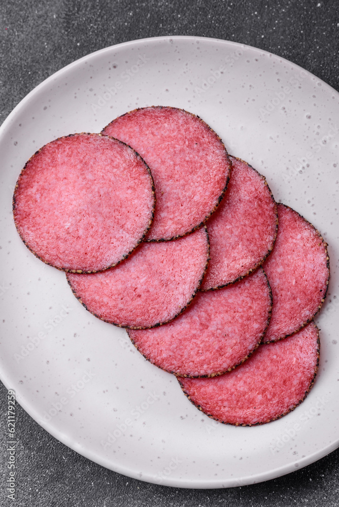 Delicious smoked salami sausage with salt, pepper, spices and herbs Delicious smoked salami sausage with salt, pepper, spices and herbs