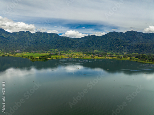 Farmland and rice fields on the Maninjau lake shore in the mountains. Sumatra, Indonesia.
