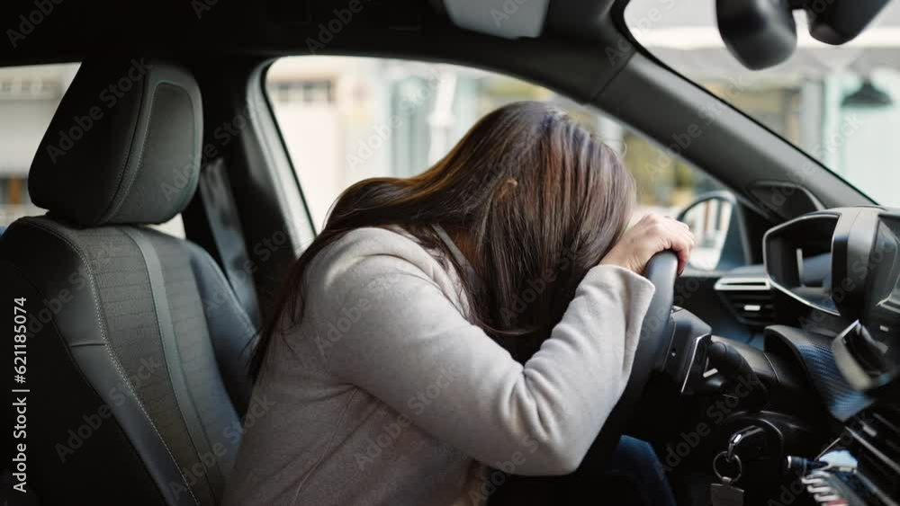 Young beautiful hispanic woman stressed driving car at street Young beautiful hispanic woman stressed driving car at street