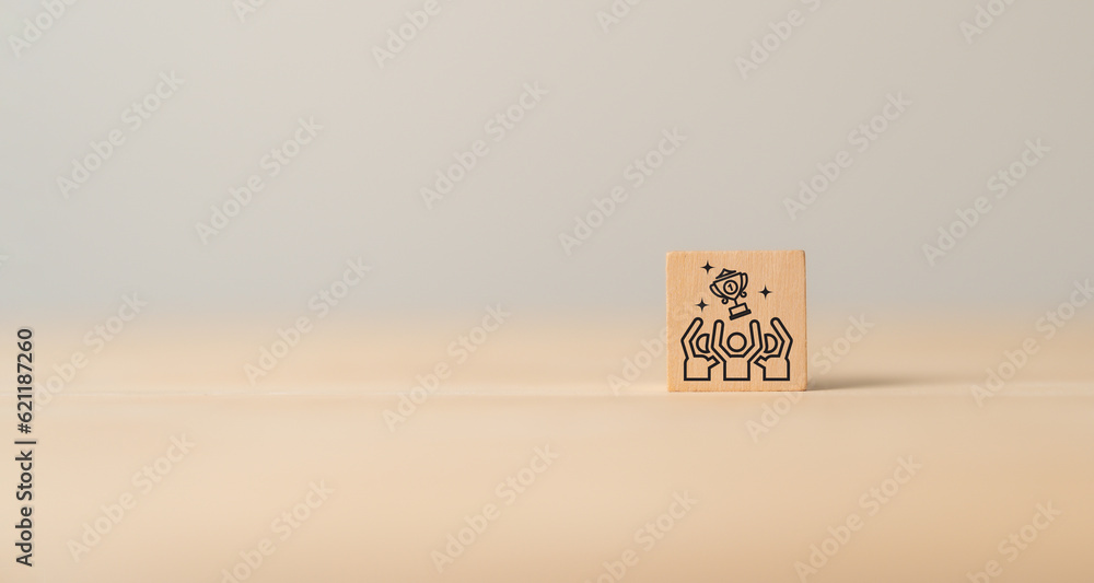 Business success and leadership concept. Teamwork running to goal and achieving successful business. Common goals, growth performance, market leader icon on wooden cube blocks with grey background. Business success and leadership concept. Teamwork running to goal and achieving successful business. Common goals, growth performance, market leader icon on wooden cube blocks with grey background.