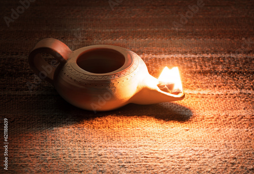 Fotografia Ancient lamp shines in the dark