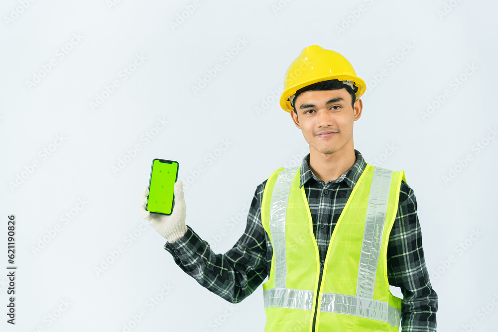 Hand drawn asian male service worker holding a green screen phone smiling confidently with his left hand He wore a brown and black striped shirt and light green coat, yellow hat and cotton gloves. Hand drawn asian male service worker holding a green screen phone smiling confidently with his left hand He wore a brown and black striped shirt and light green coat, yellow hat and cotton gloves.