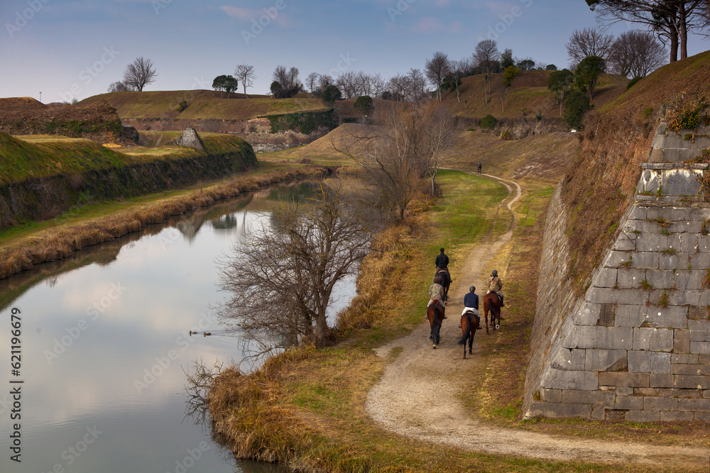 Horseback riders gracefully explore Palmanova's bastions Horseback riders gracefully explore Palmanova's bastions