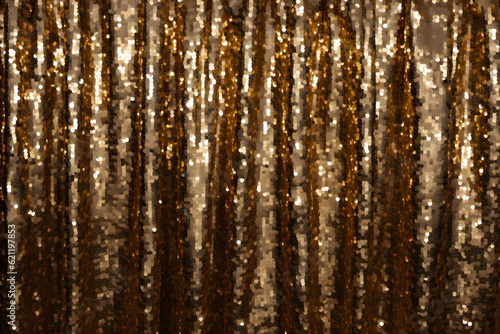 Close-up of stripes of gold glitter sand textured background