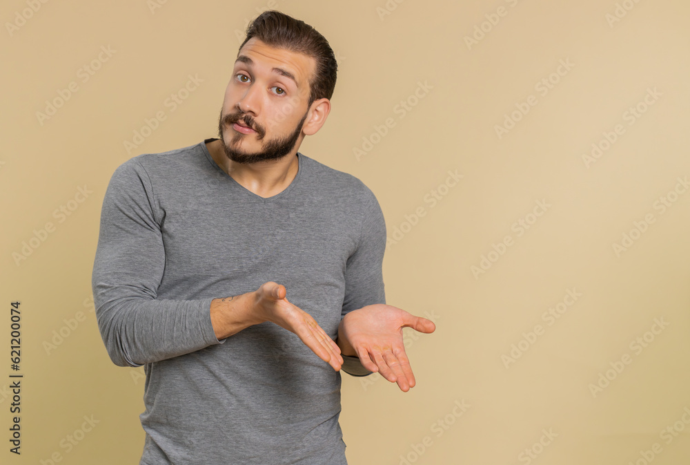 Middle eastern man raising hands asking what why reason of failure disbelief irritation by troubles, trendy social media meme anti lifehacks, ridicules people who complicate simple tasks for no reason - obrazy, fototapety, plakaty 