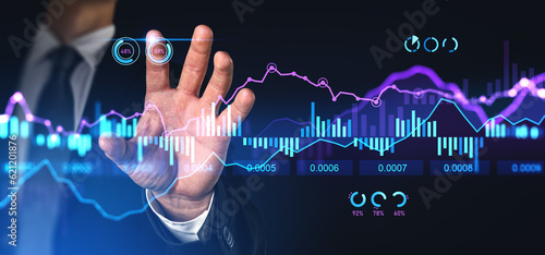 Businessman finger touch forex diagrams and stock market data with lines