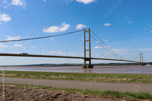 The Humber Bridge crossing the estuary at Kingston-upon-Hull, England, A single-span road suspension bridge at low tide. photo